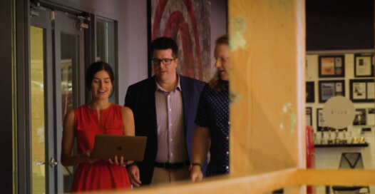 Rocket55 team members collaborate on their way to a meeting